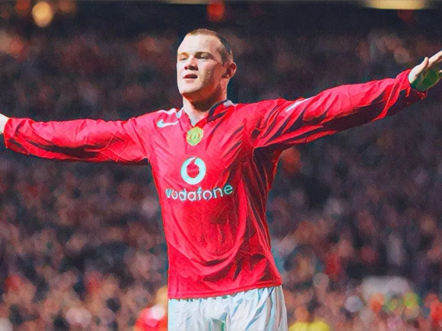 Wayne Rooney festeggia una delle tre reti all'esordio con il Manchester United